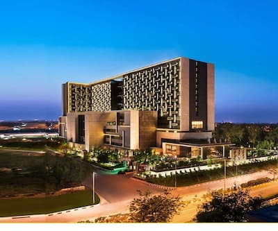 https://imgcld.yatra.com/ytimages/image/upload/t_hotel_yatra_city_desktop/v1523279308/Hotel/New Delhi/00017545/Facade_-_The_Leela_Ambience_Convention_Hotel_Delhi_aAa95Z.jpg